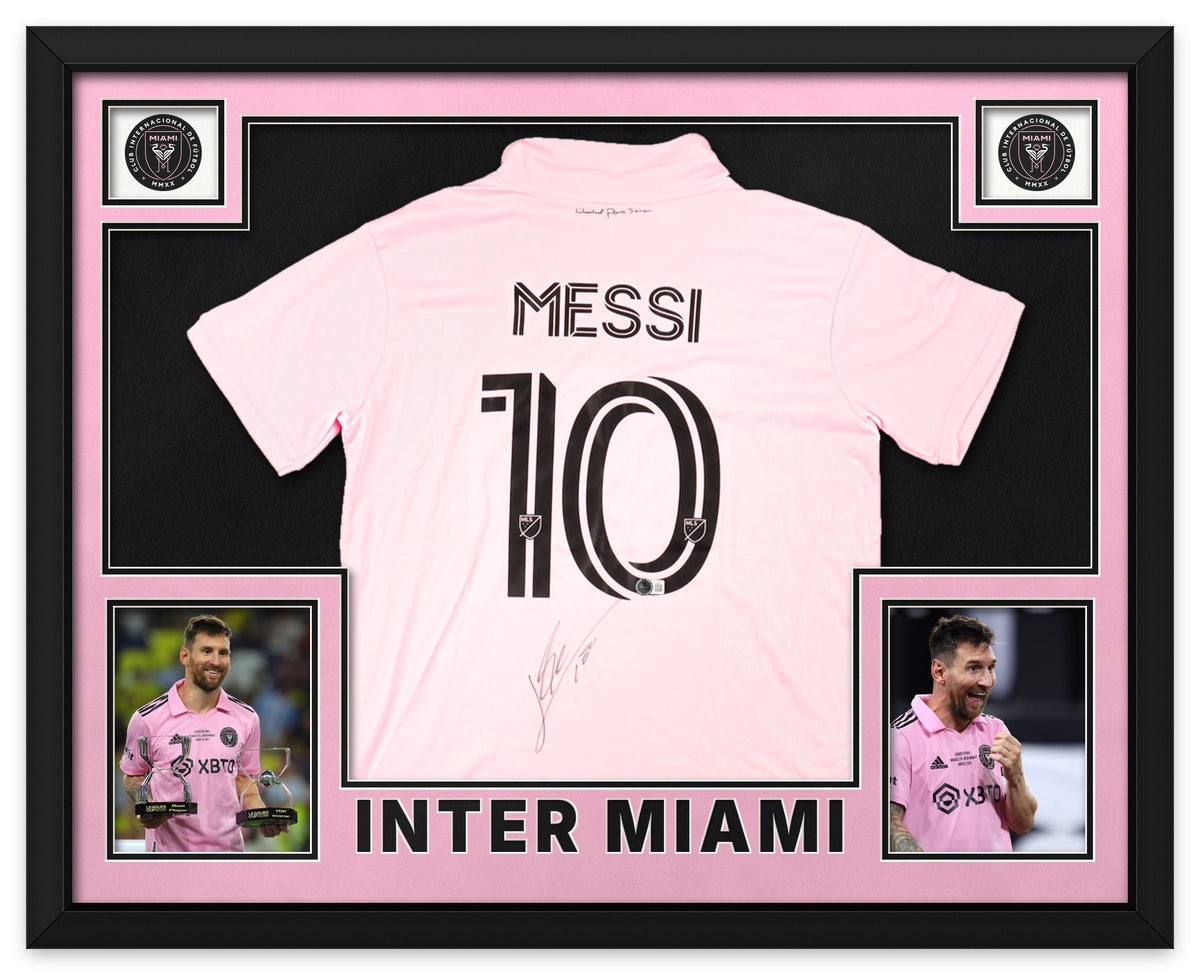 Lionel Messi signed pink Inter Miami number 10 shirt, signed in black ink with the Beckett hologram, shown in a black custom frame with pink and black matting, Inter Miami crests in the upper corners, two photographs and INTER MIAMI lettering