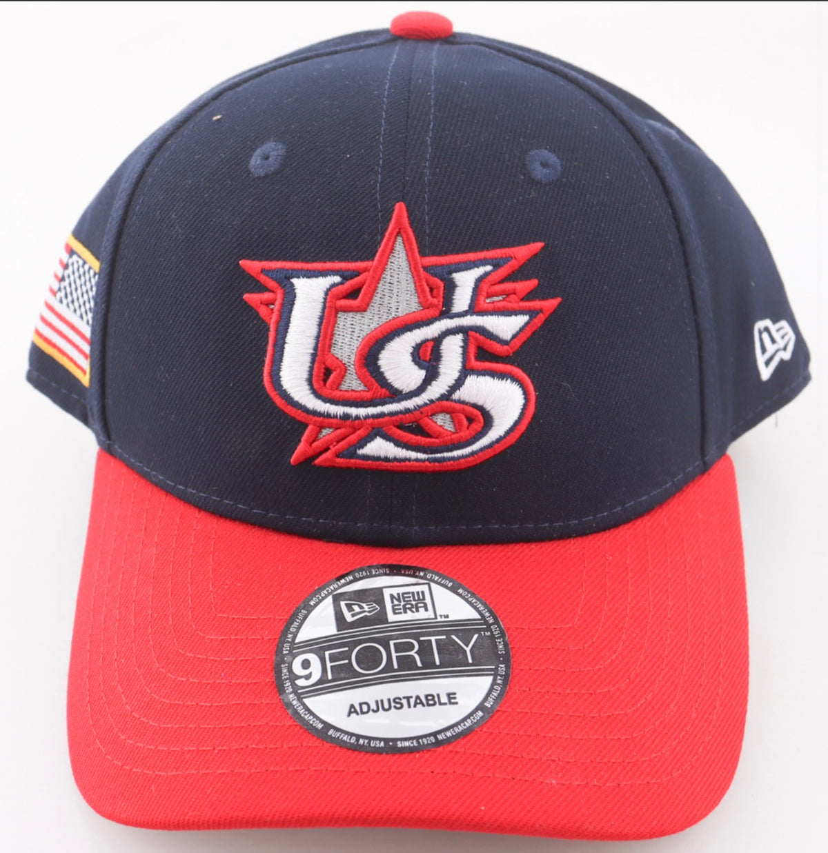 Front of the navy and red Team USA World Baseball Classic New Era 9FORTY hat with the US star logo and an American flag side patch