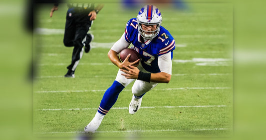 Josh Allen scrambling with the football for the Buffalo Bills
