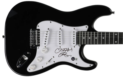 Ozzy Osbourne signed black electric guitar, signed in black marker on the white pickguard, Beckett Witnessed