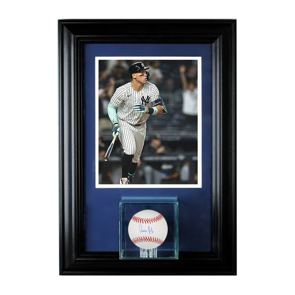 Aaron Judge signed baseball in a glass cube, custom framed with a photo of Judge in Yankees home pinstripes, black frame, navy mat