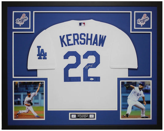 Clayton Kershaw signed Los Angeles Dodgers #22 white home jersey in a custom frame with royal blue mat, two Dodgers logo patches, two pitching photos and an engraved nameplate