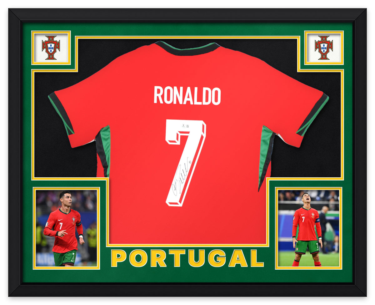 Cristiano Ronaldo signed red Portugal number 7 home shirt, signed in black ink with the Beckett hologram, shown in a black custom frame with green and black matting, Portuguese Football Federation crests in the upper corners, two photographs and PORTUGAL lettering