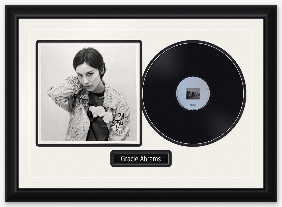 Gracie Abrams signed Daughter from Hell art card, a black and white portrait in an embellished jacket, signed in black, framed beside the black LP in a black frame with white matting, black reveals and a black Gracie Abrams nameplate