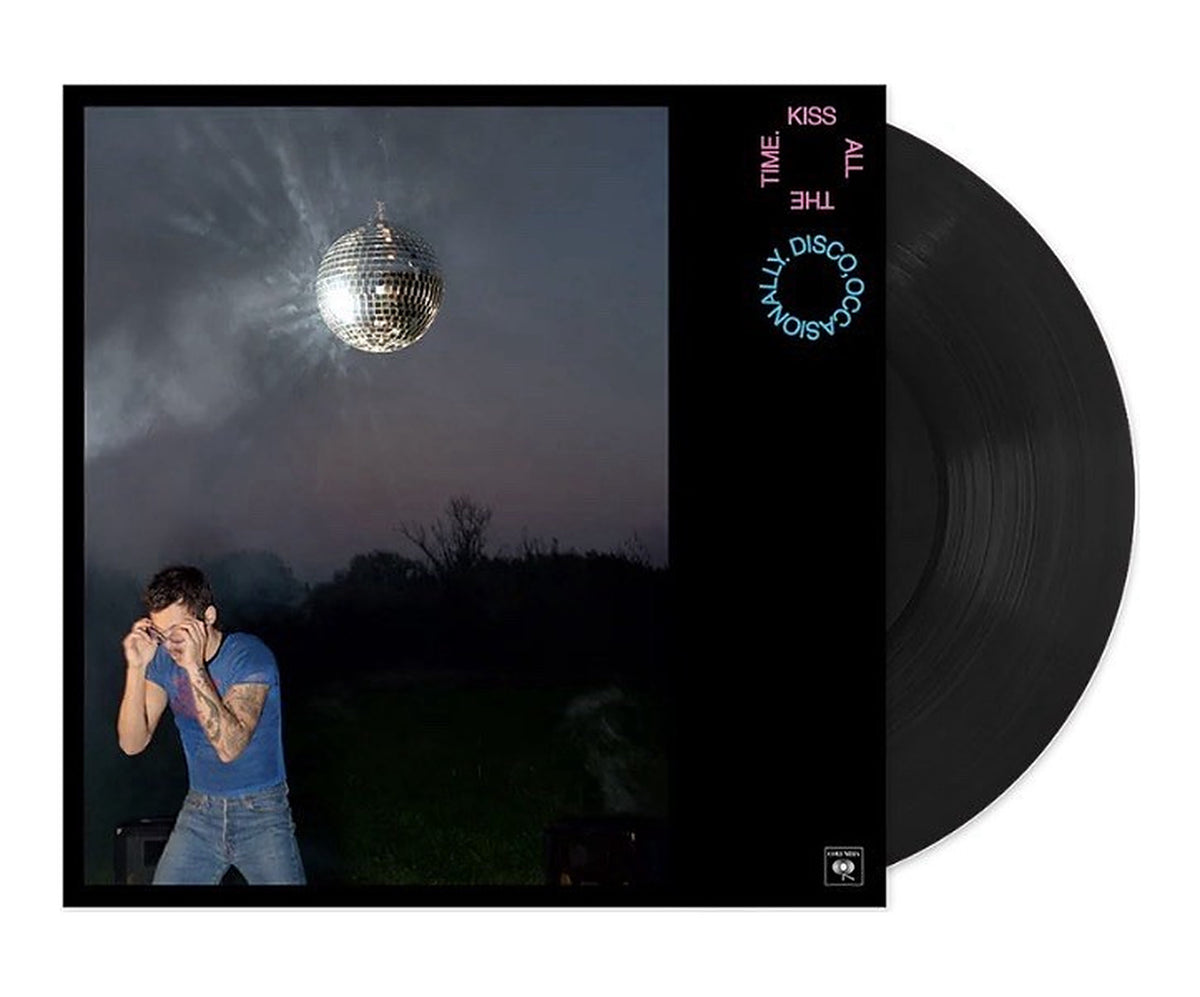 Harry Styles Kiss All The Time. Disco, Occasionally. album jacket with a disco ball over a twilight field, shown with the black vinyl record