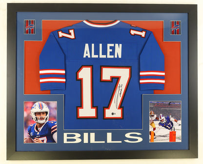 Josh Allen signed royal blue Buffalo Bills number 17 jersey in a black custom frame, signed in black marker on the white numerals with the Beckett hologram, matted in orange and blue with two action photos and the Bills logo