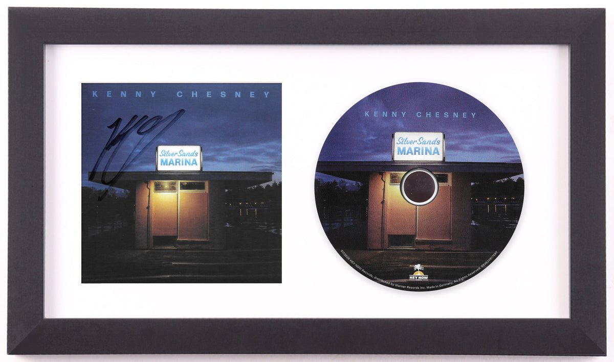 Kenny Chesney signed Silver Sands Marina art card framed beside the album disc in a black frame with a white mat, preview of the finished display