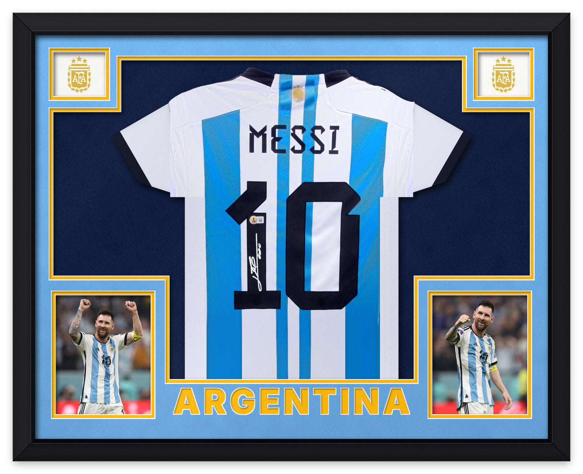 Lionel Messi signed sky blue and white Argentina number 10 home shirt, signed in white ink with the Beckett hologram, shown in a black custom frame with sky blue and navy matting, AFA crests in the upper corners, two photographs and ARGENTINA lettering