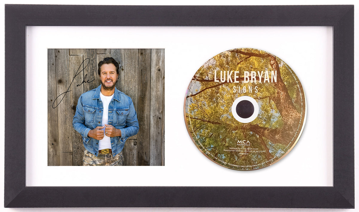 Luke Bryan signed Signs art card and album disc in a black frame with a white mat