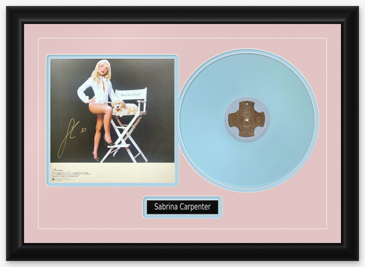 Sabrina Carpenter signed Man's Best Friend 11x11 insert, signed in gold ink, framed beside the opaque light blue LP in a black frame with blush pink matting, light blue reveals and a black Sabrina Carpenter nameplate