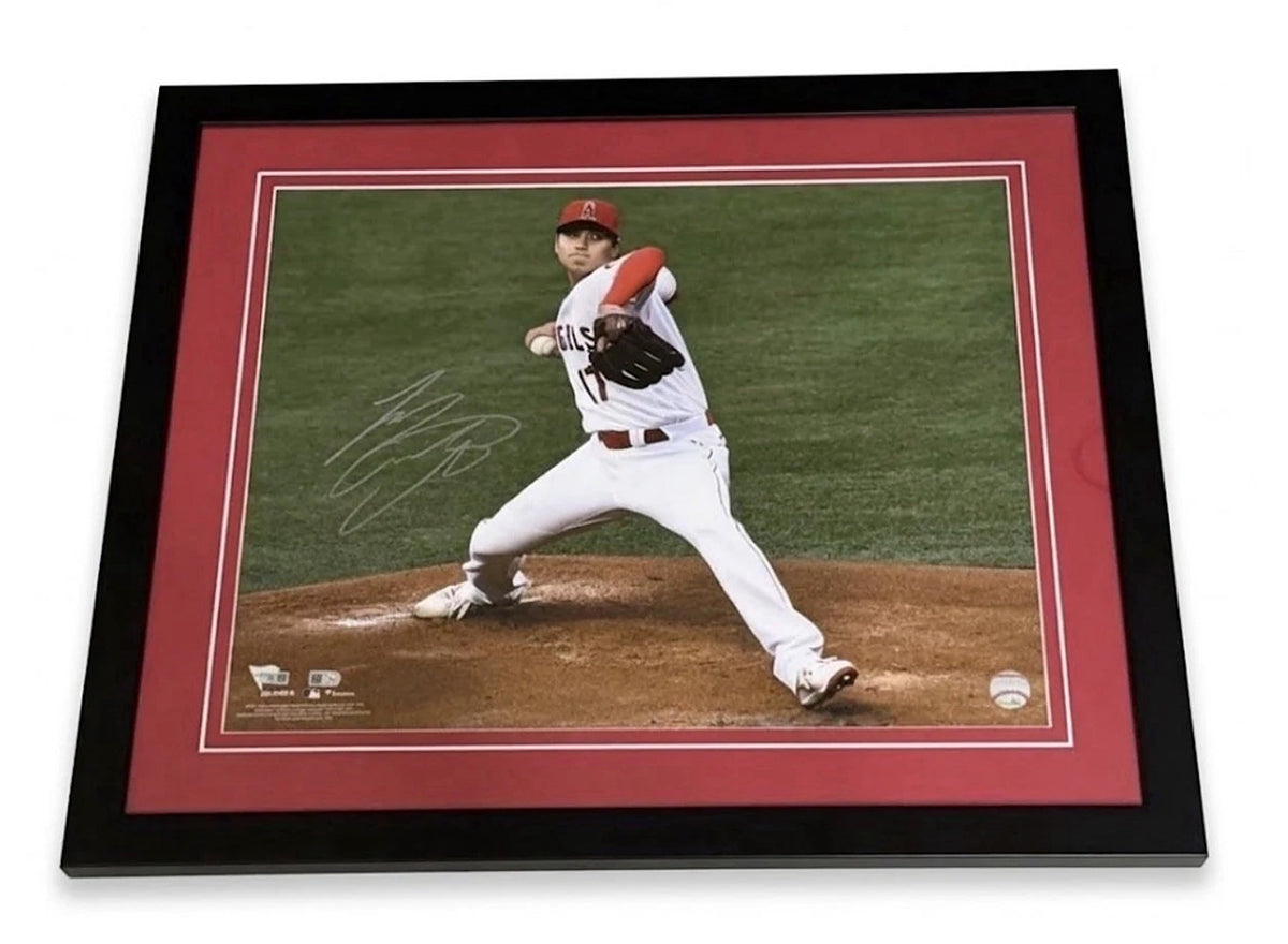 Shohei Ohtani signed 16x20 photo pitching in the Angels home white uniform, signed in silver on the left side, custom framed in black with red matting, MLB and Fanatics authenticated