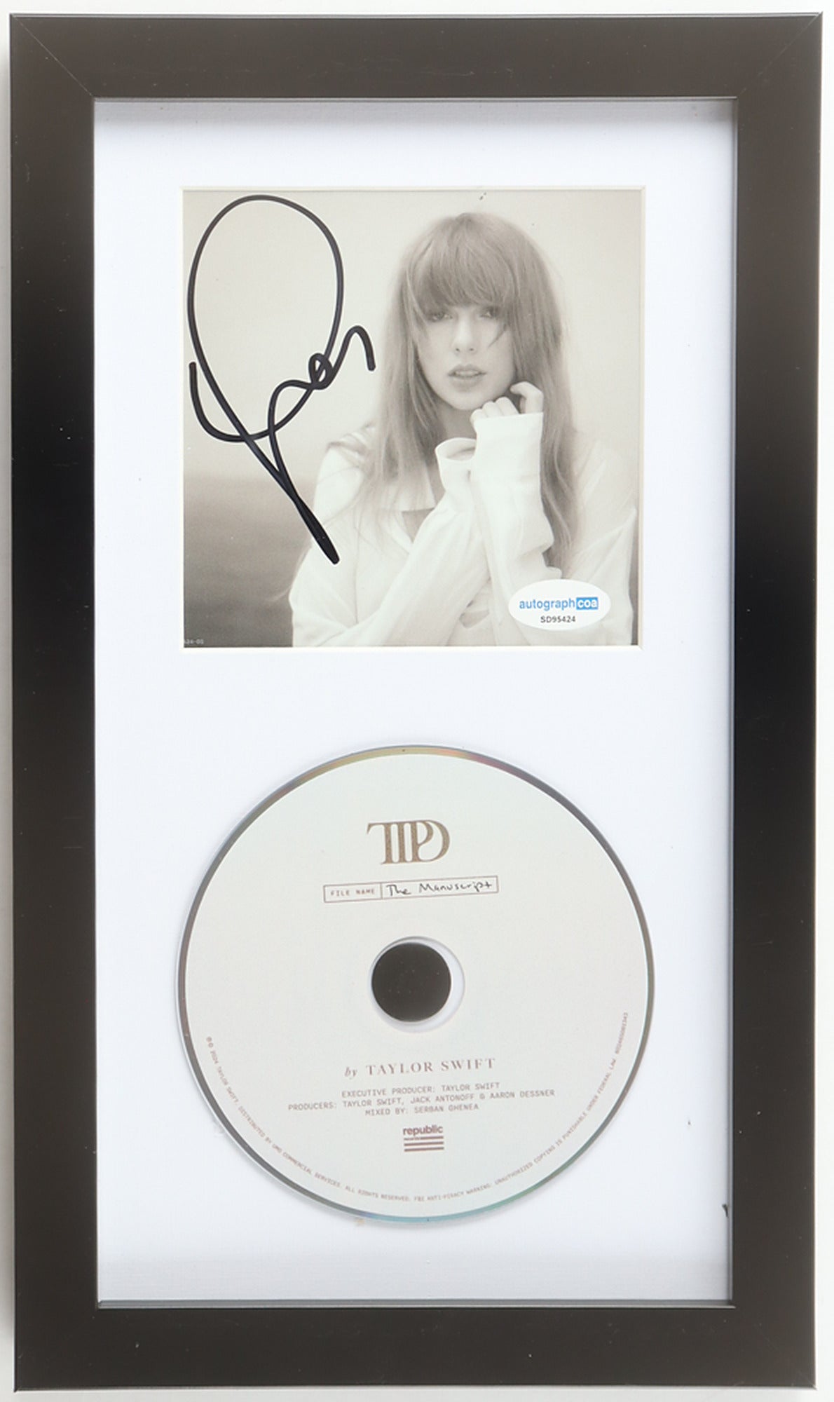 Taylor Swift signed The Tortured Poets Department framed CD display, sepia portrait insert signed in black marker with the ACOA label, above The Manuscript album disc in a black frame with white mat