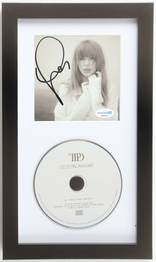 Taylor Swift signed The Tortured Poets Department framed CD display, sepia portrait insert signed in black marker with the ACOA label, above The Manuscript album disc in a black frame with white mat
