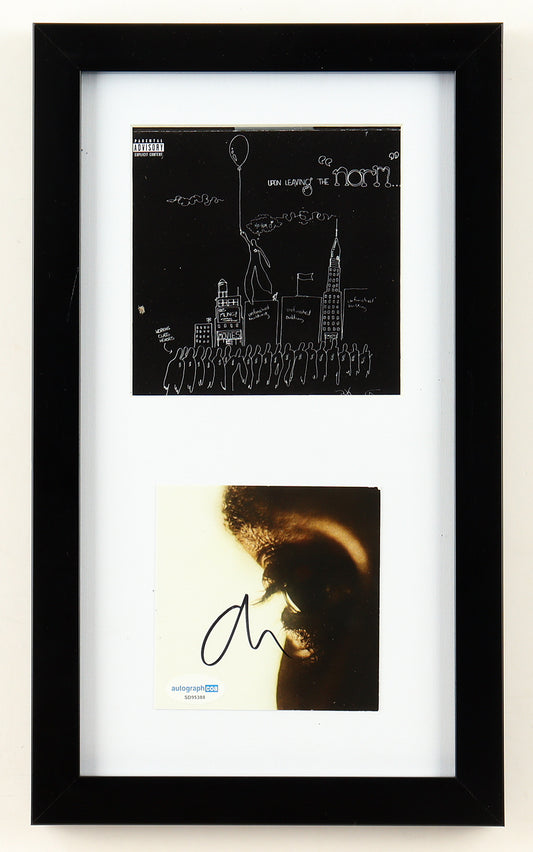 The Weeknd signed Hurry Up Tomorrow art card with an ACOA sticker, framed below the Basquiat Upon Leaving the Norm collector cover art, white mat and black frame